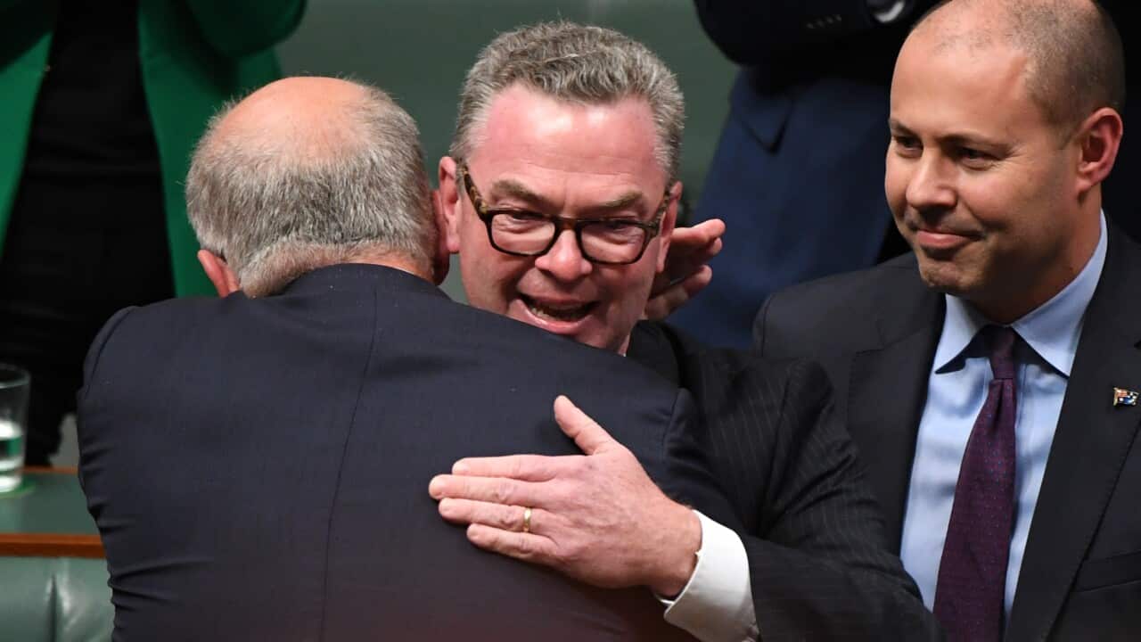 Christopher Pyne hugs Prime Minister Scott Morrison after delivering his valedictory speech.
