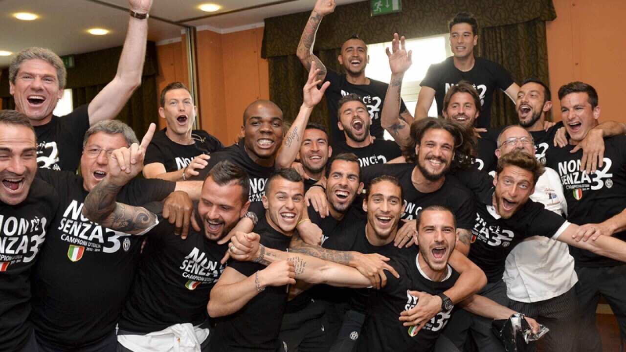 Juventus players celebrate after winning the Serie A overall title