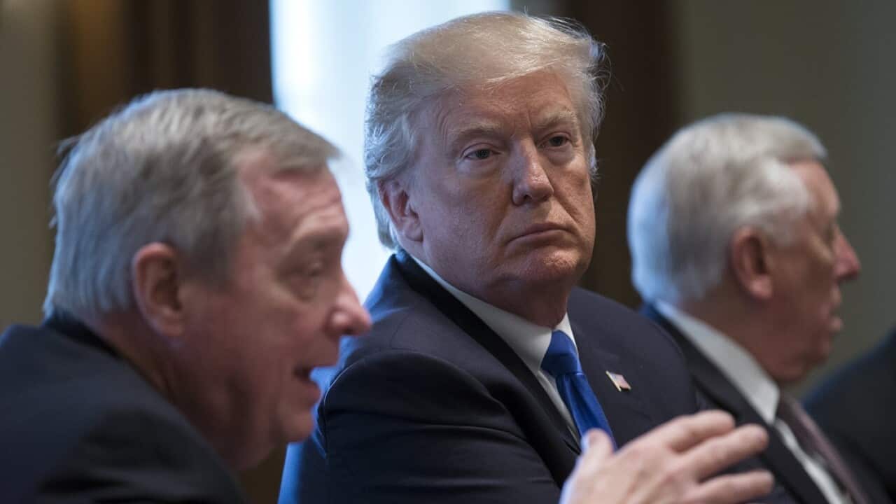 US President Donald J. Trump (centre) with Democratic Senator from Illinois Dick Durbin (left).