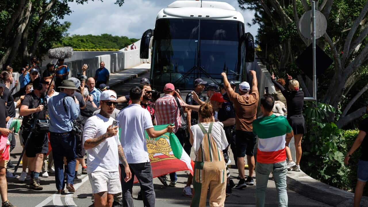 Protesters surround bus carrying Iran's women's football team to Gold Coast airport