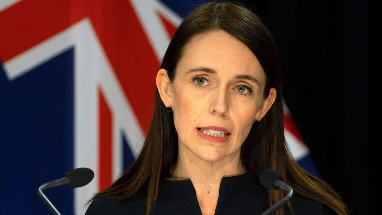 A woman speaking into a microphone