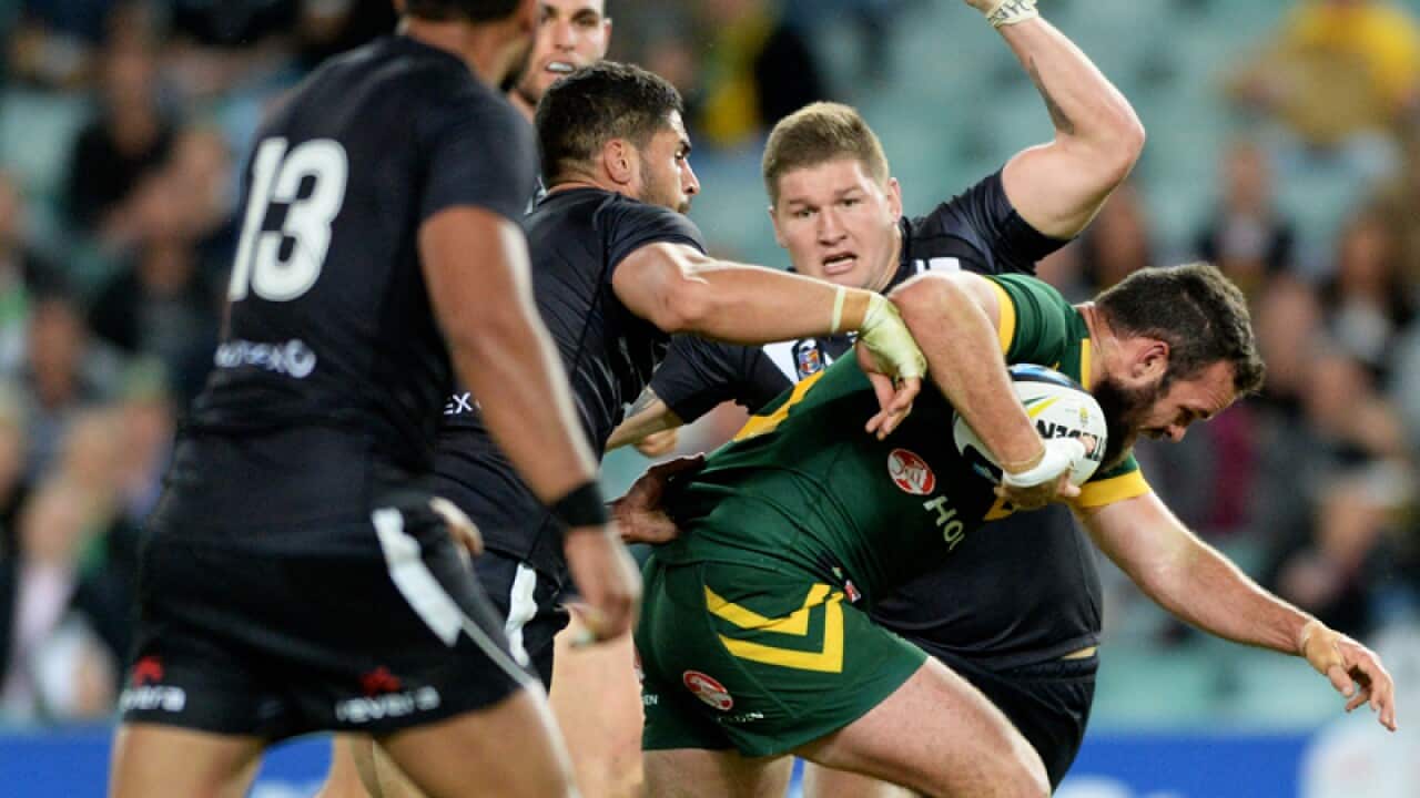 Australia's Nate Myles tries to push through the New Zealand defence