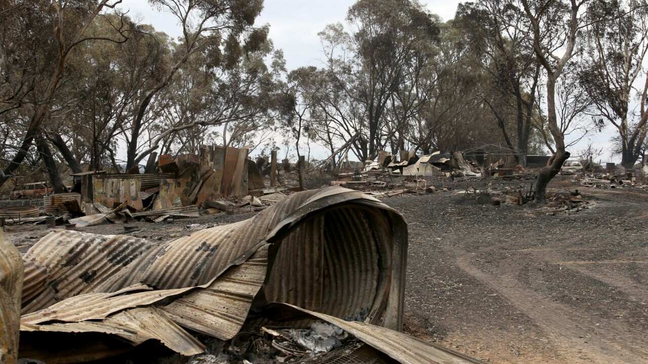A destroyed home outside Woodside in Adelaide, Sunday, December 22, 2019. The Cudlee Creek fire has burnt through 25,000 hectares within a 127 kilometre perimeter in the Adelaide Hills. (AAP Image/Kelly Barnes) NO ARCHIVING