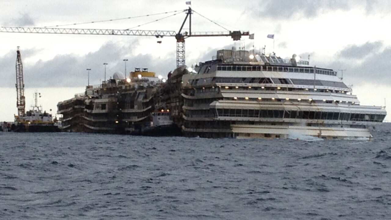 The Costa Concordia cruise liner lies upright