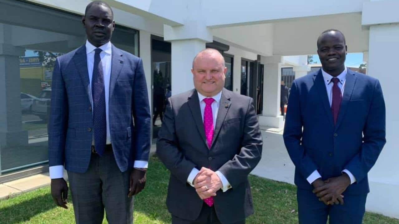 Bol Machar and his colleague at the office of Hon Assistance minister for Customs, Community Safety and Multicultural Affairs Jason Wood