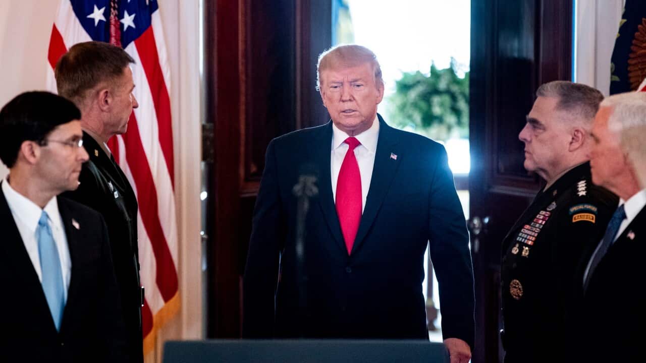 US President Donald J. Trump (C) walks out to deliver a statement on the US response to Iranian missile strikes