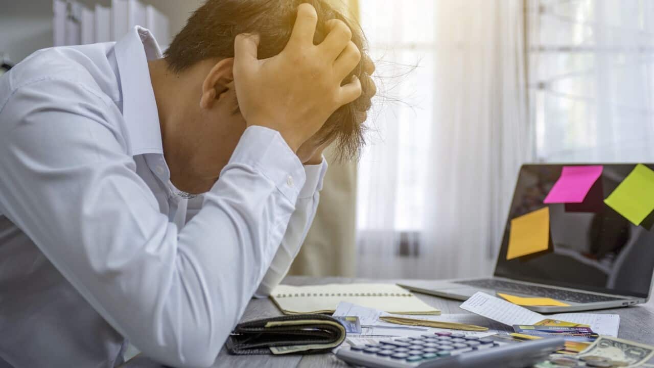 Don't let debt get out of control says helpline - Getty