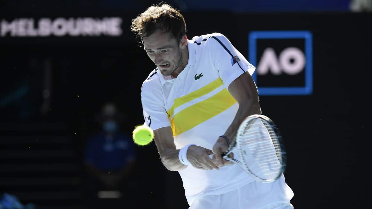 Russia's Daniil Medvedev hits a backhand return to compatriot Andrey Rublev during their match at the Australian Open Tennis championships in Melbourne, Australia, Wednesday, Feb. 17, 2021. (AP Photo/Andy Brownbill)