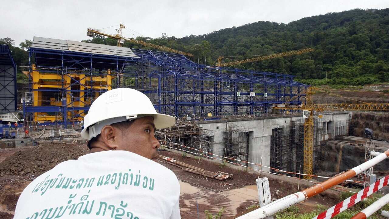 A Lao worker rests near to the Nam Theun 2 power (HOANG DINH NA - AFP via Getty)
