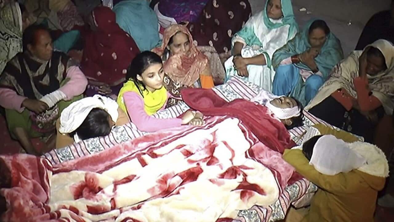 People mourn the death of a family member in Pakistan