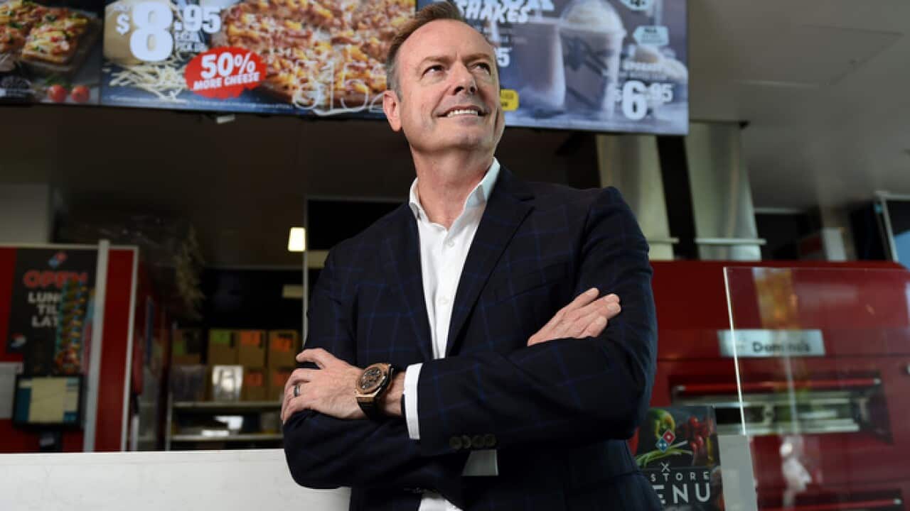 Don Meij, CEO of Domino's Pizza, poses for photos in one of the company's stores in Brisbane, Wednesday, Dec. 21, 2016. (AAP Image/Dan Peled) NO ARCHIVING