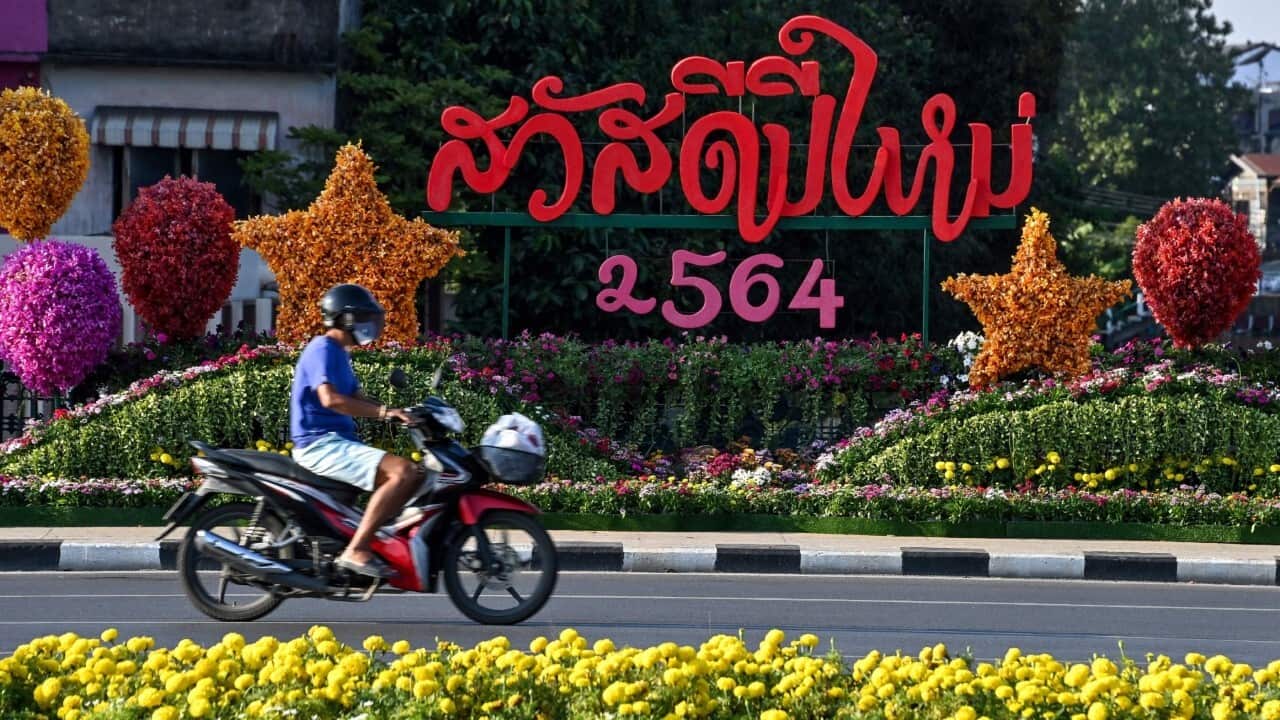 A motorist rides pass a floral design marking the arrival of the Thai new year 2564 in Bangkok (Mladen Antonov - AFP via Getty images)