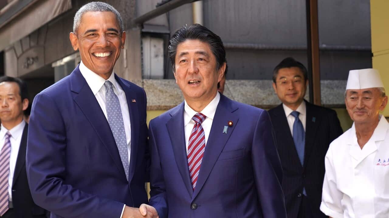 Former US President Barack Obama and Japanese PM Shinzo Abe in Tokyo.