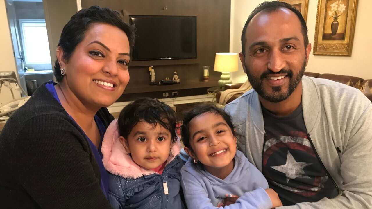 Inderdeep and Harpreet Sandhu with their two children.
