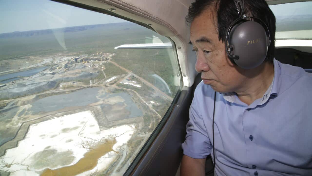 Former Japanese Prime Minister Naoto Kan views the Ranger uranium mine from the air.