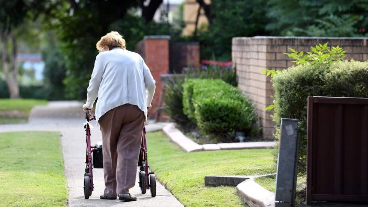 An elderly woman uses a mobility walker in Sydney on Sunday, April 30, 2017. (AAP Image/Paul Miller) NO ARCHIVING