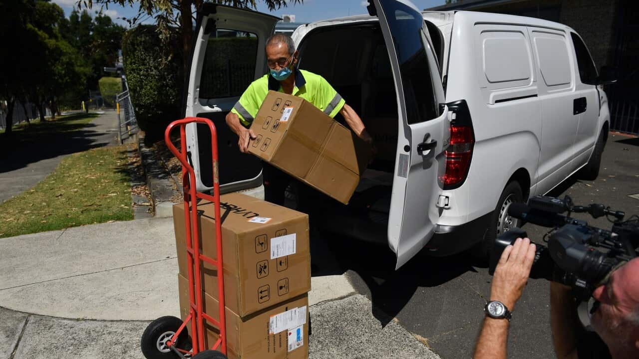 Worker delivering antigen tests in Melbourne