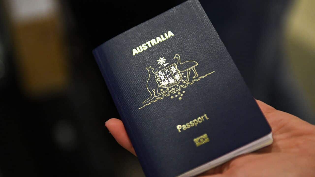 A person holding an Australian passport.