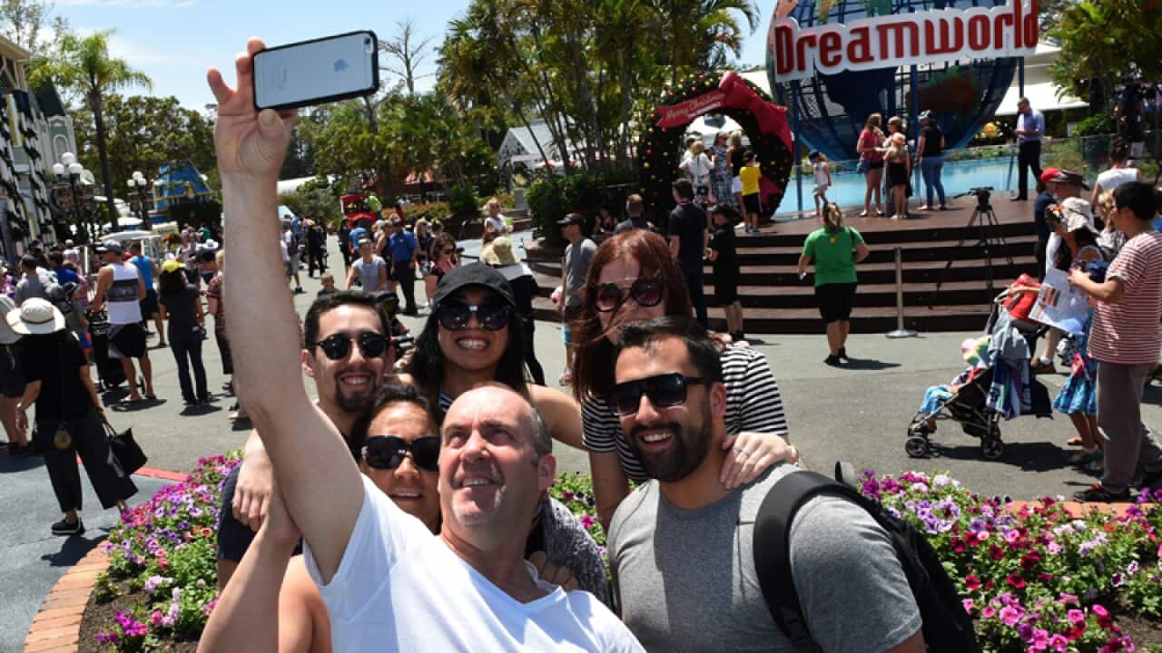 Visitors take a selfie at Dreamworld