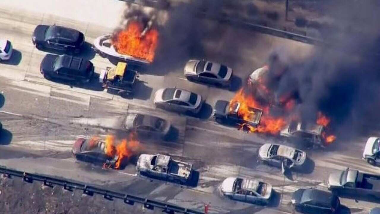 Cars are shown burning on the Interstate 15 freeway in the Cajon Pass, California in the frame grab from KNBC video July 17, 2015.