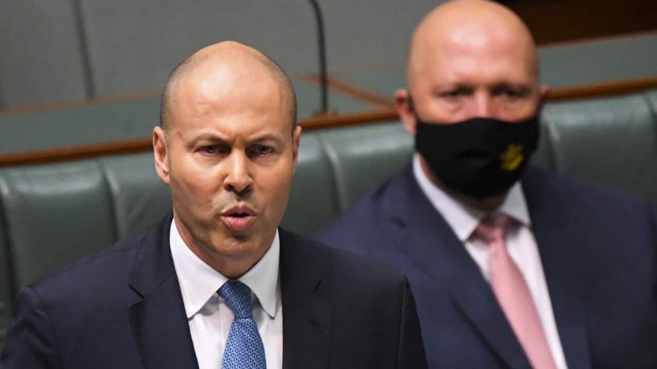 Australian Treasurer Josh Frydenberg hands down his fourth budget in the House of Representatives at Parliament House in Canberra, Tuesday, March 29, 2022. (AAP Image/Lukas Coch) NO ARCHIVING