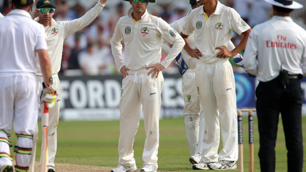 Australian captain Michael Clarke stares at umpire Aleem Dar