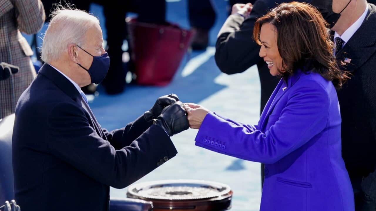 President-elect Joe Biden, left, fist bumps Vice President Kamala Harris after she was sworn in during the inauguration, Wednesday, Jan. 20, 2021, at the U.S. Capitol in Washington.