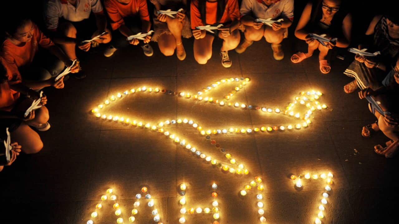 Chinese student vigil for MH17 victims.