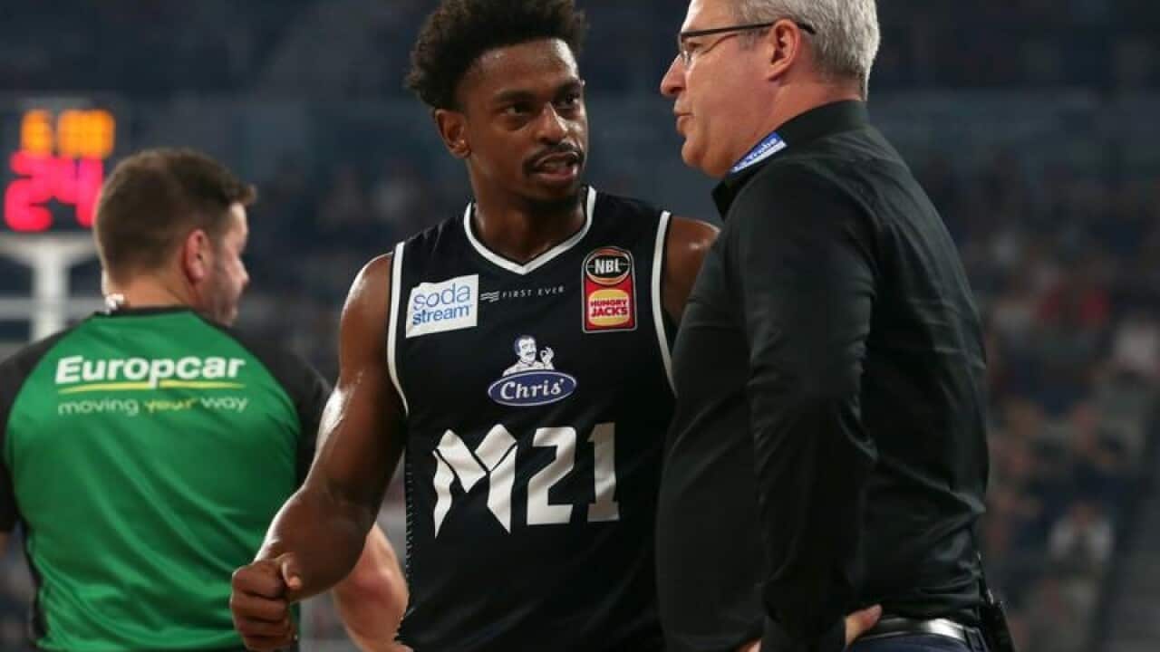 Casper Ware talks with Melbourne United coach Dean Vickerman