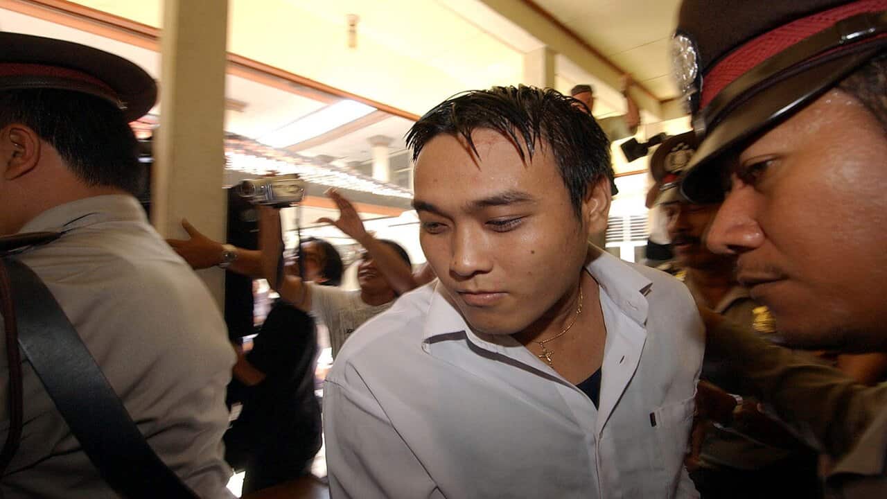 2006 file photo of one of the "Bali Nine" Tan Duc Thanh Nguyen being bought to a holding cell at Denpasar Court