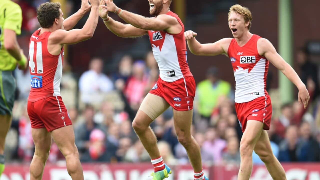 Jarrad McVeigh of the Swans celebrates