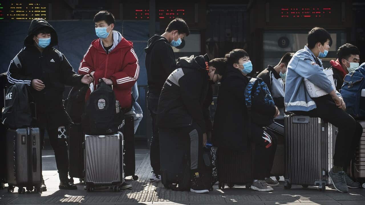 Chinese students wear masks in Beijing.