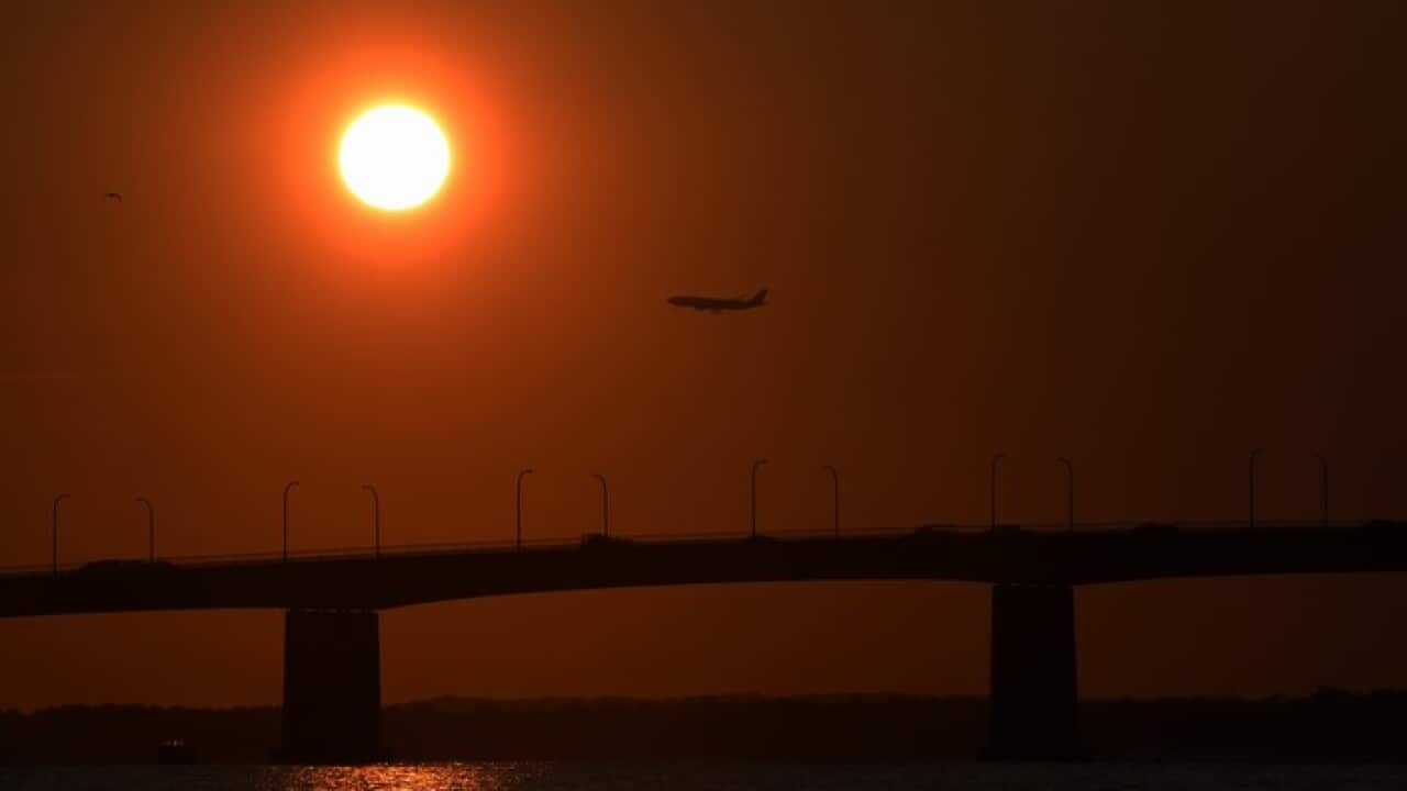 The sun rises over Captain Cook Bridge, Sydney