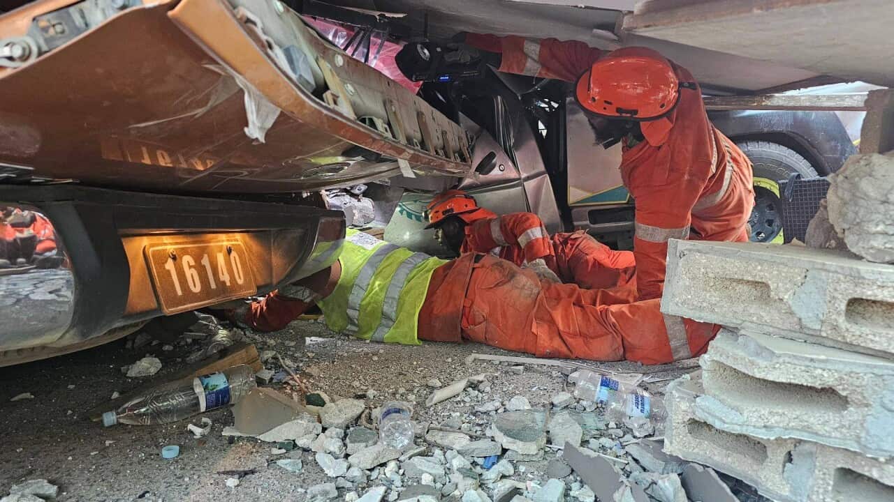 Rescue teams conducting search and rescue operations following an earthquake in Port Vila, Vanuatu