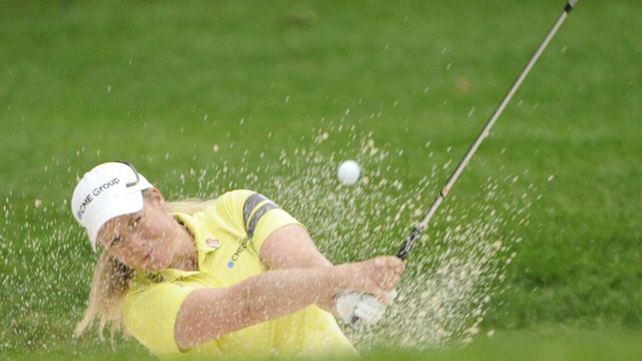 Brittany Lincicome blasts out of a trap