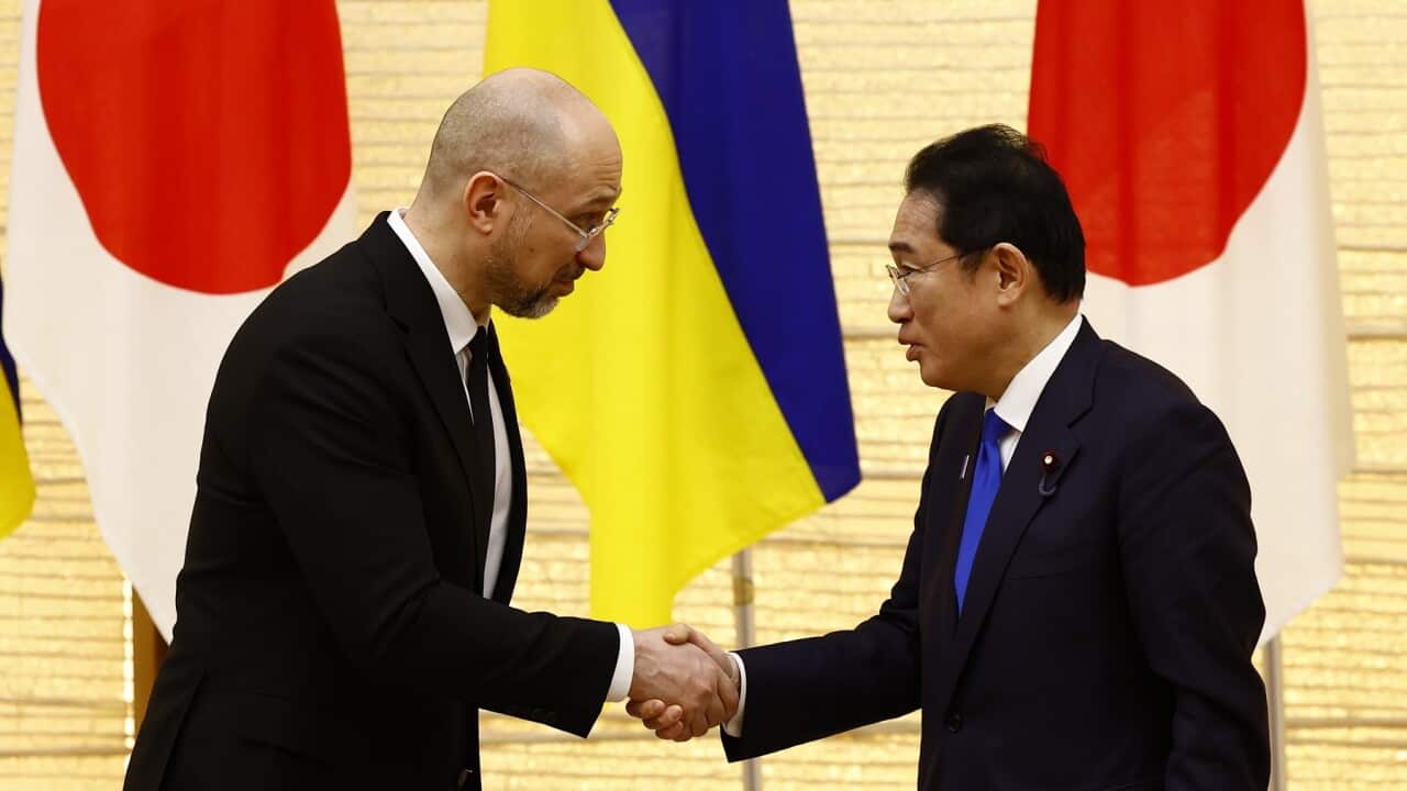 Ukraine's Prime Minister Denys Shmyhal, left, shakes hands with Japanese Prime Minister Fumio Kishida (AAP)