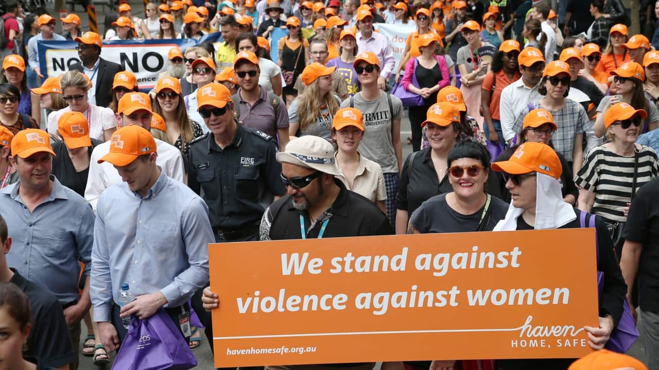 Participants are seen marching during the 11th annual Walk Against Family Violence in Melbourne, Monday, November 25, 2019. (AAP Image/David Crosling) NO ARCHIVING