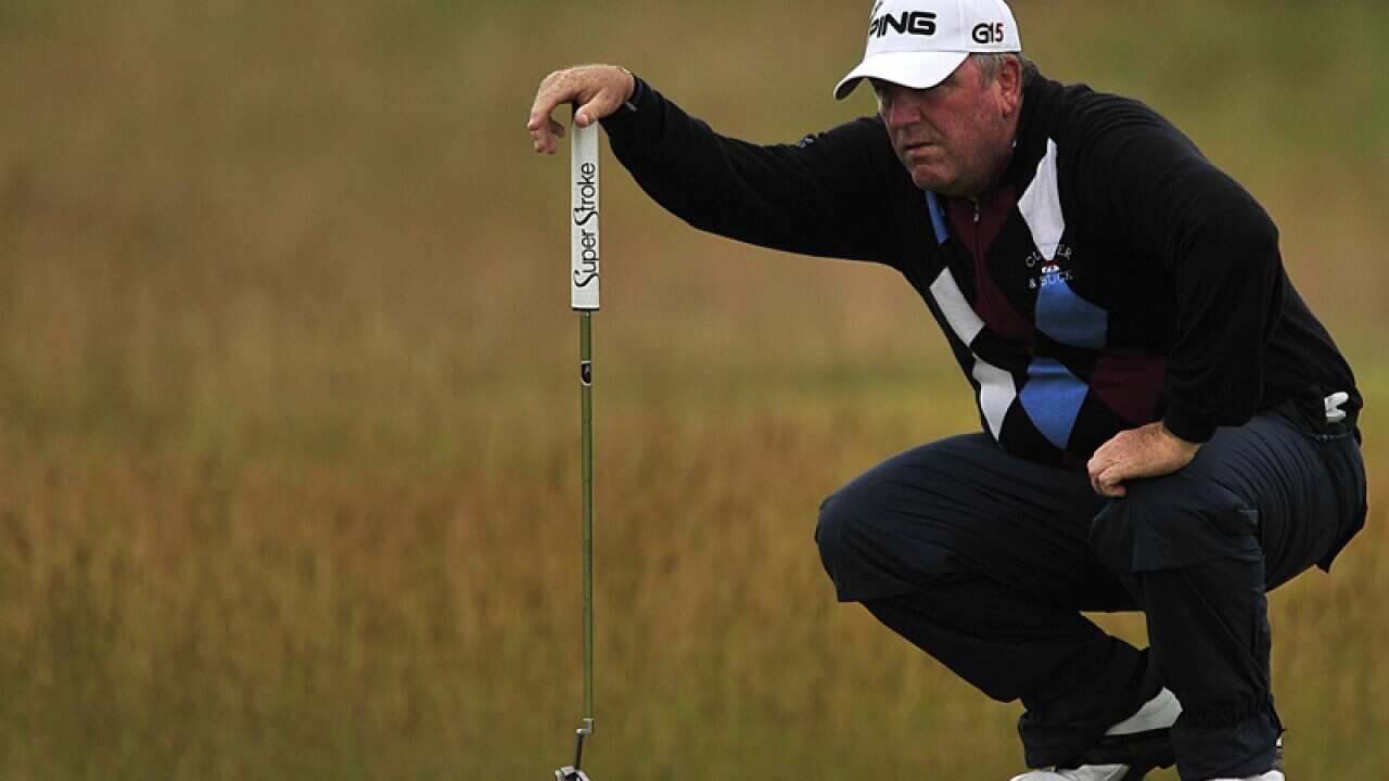 Mark Calcavecchia putts.