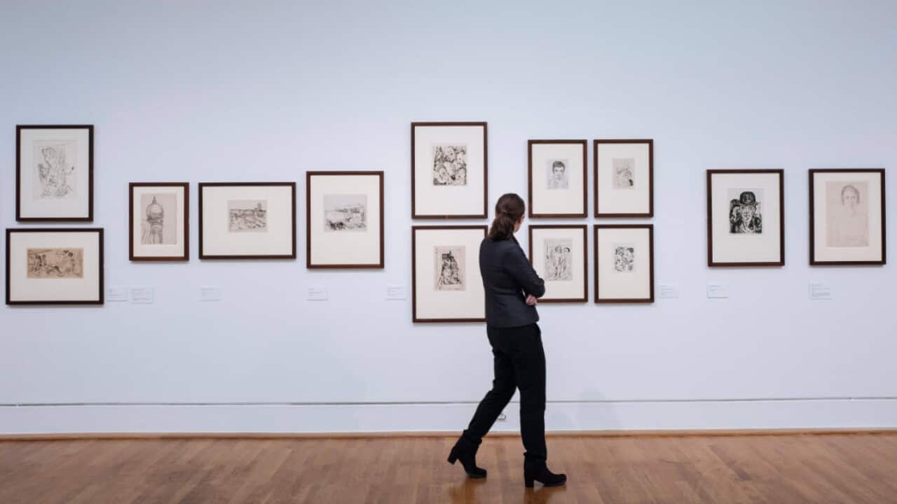 A visitor walks past by drawings by Max Beckmann at the Kulturforum Museum in Berlin, Germany, 25 October 2018.