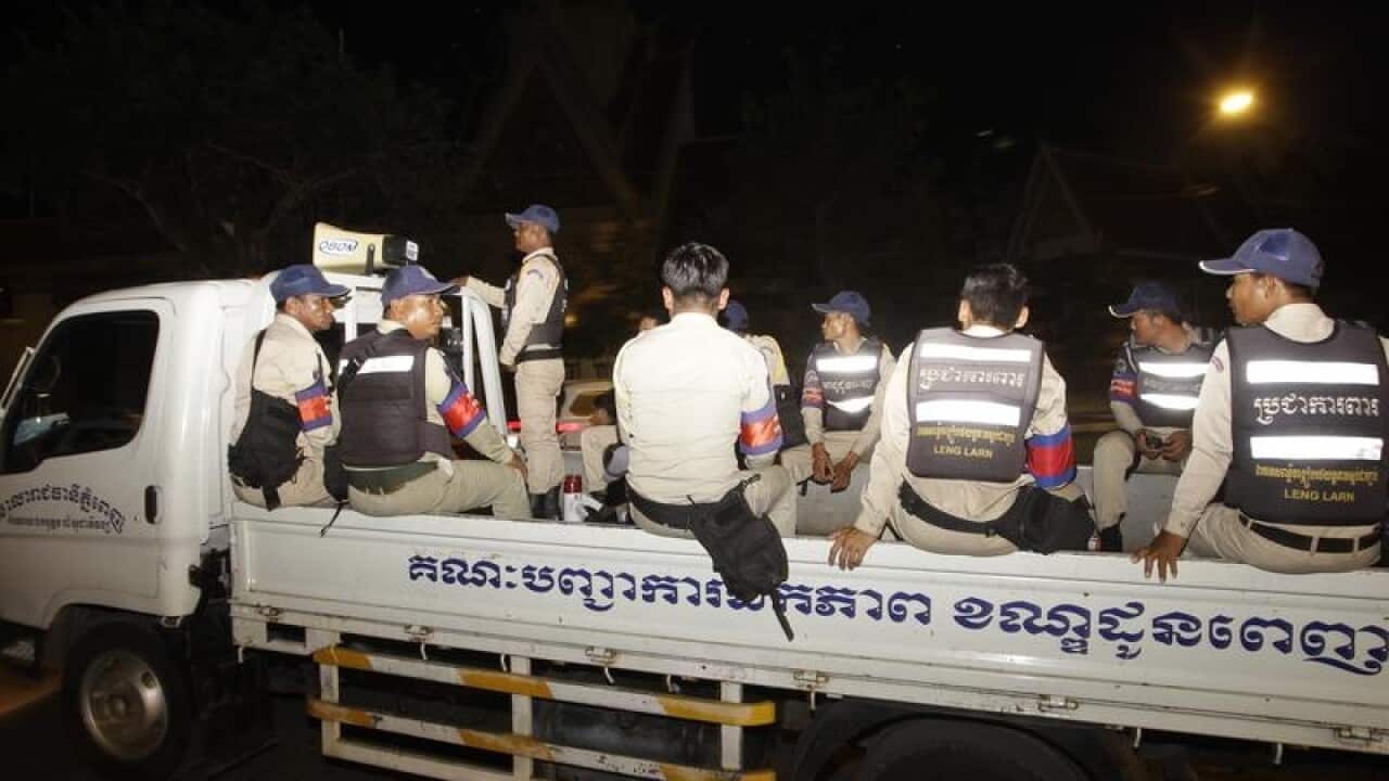 Security guards outside Cambodian Supreme court.