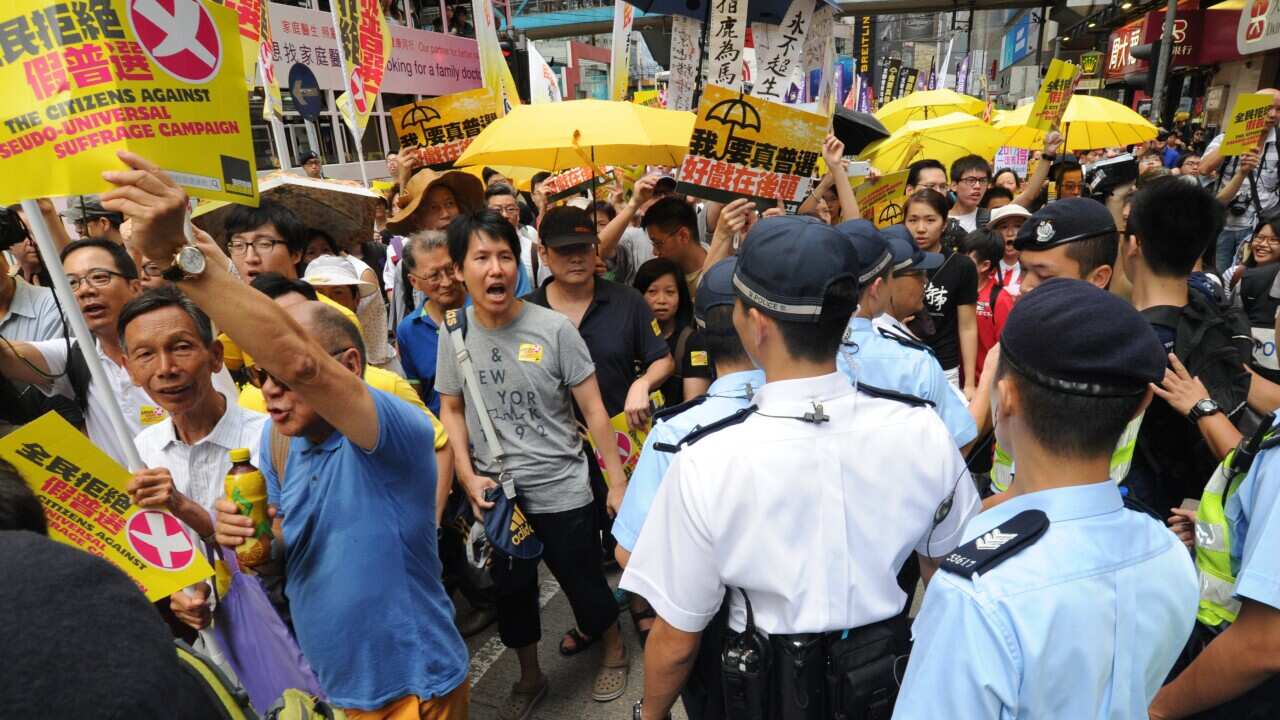 Hong Kong pro-democracy protesters march to Legislate Council to support a veto of electoral reform package approved by Beijing in Hong Kong, China, June 14, 2015. ( The Yomiuri Shimbun/AP)