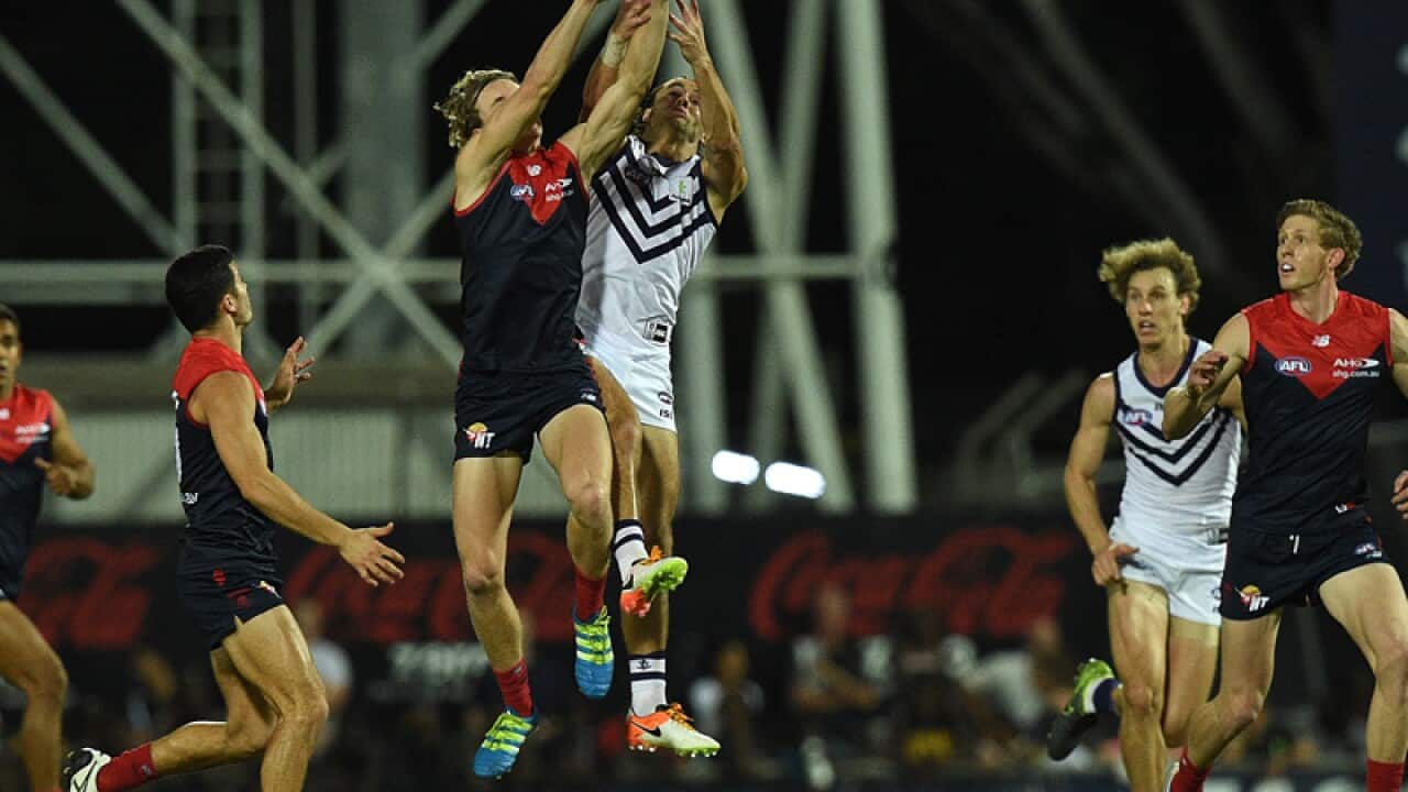 Jayden Hunt of the Demons competes for the ball