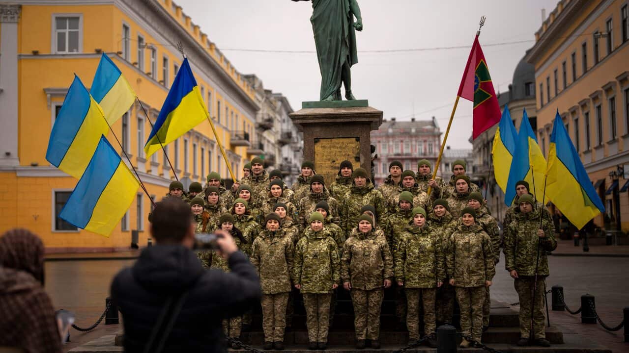 Ukrainian Army soldiers pose for a photo as they gather to celebrate a Day of Unity in Odessa, Ukraine, Wednesday, 16 February, 2022.