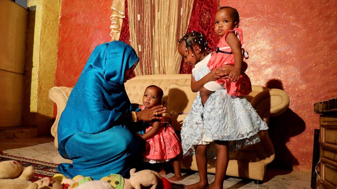 Youssria Awad plays with her daughters in their home, in Khartoum, Sudan, 14 June 2020. She refuses to carry out female genital mutilation on them.