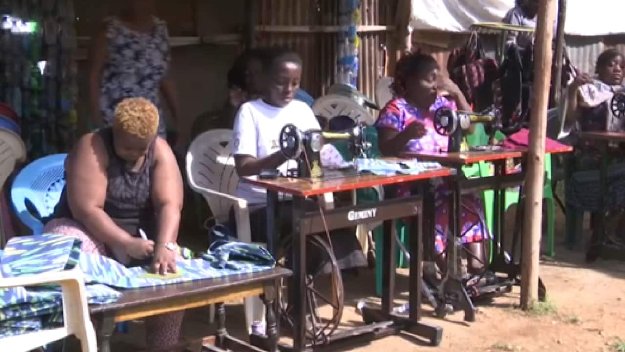 Women with a disability in Kenya who earn a living stitching reusable sanitary pads (AP).png