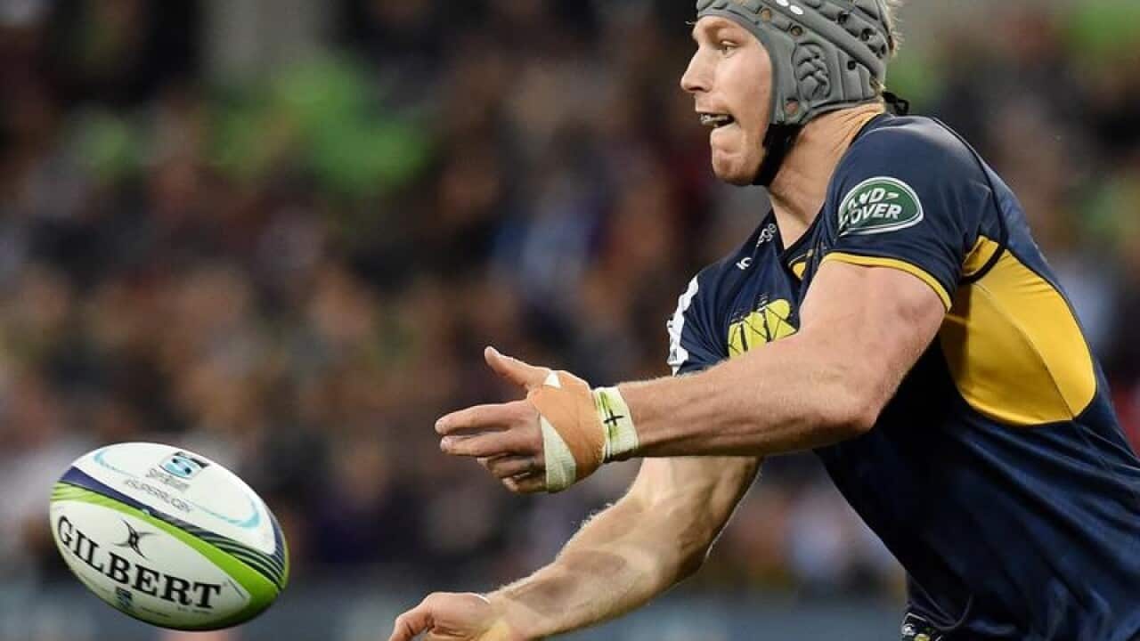David Pocock of the Brumbies passes during the Round 12.