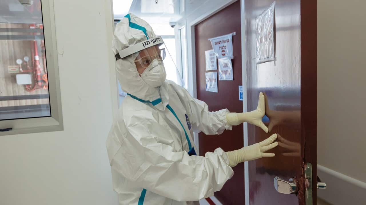 A doctor is seen at the entrance to an isolated ward to treat Covid-19 patients at Hadassah hospital
