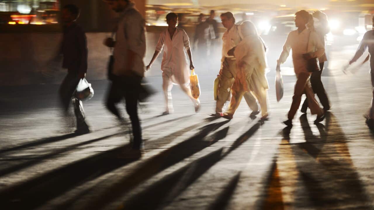 People cross a busy street in New Delhi Getty.jpg