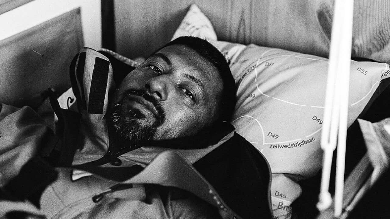 Indian solo yachtsman Abhilash Tomy lying in his bunk aboard his 10-metre vessel Thuriya.