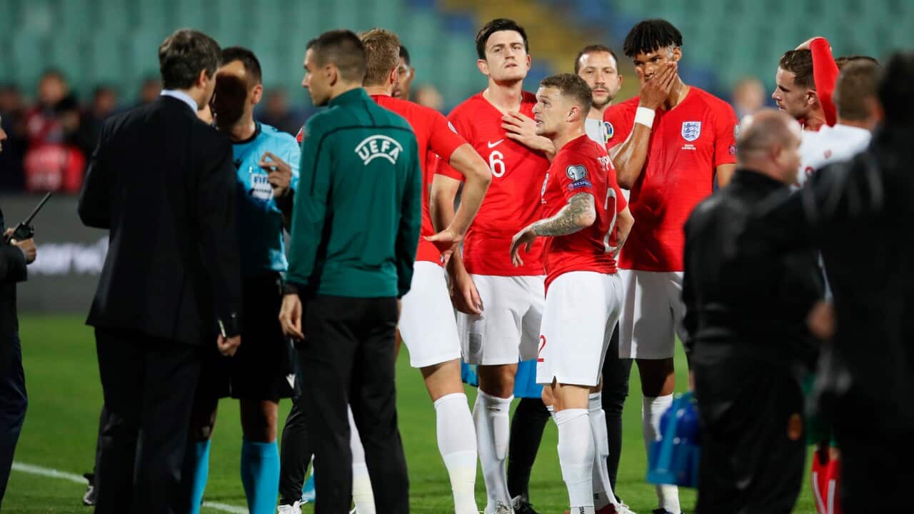 Harry Maguire and Tyrone Mings of England look on as racism is reported to UEFA officials in Sofia